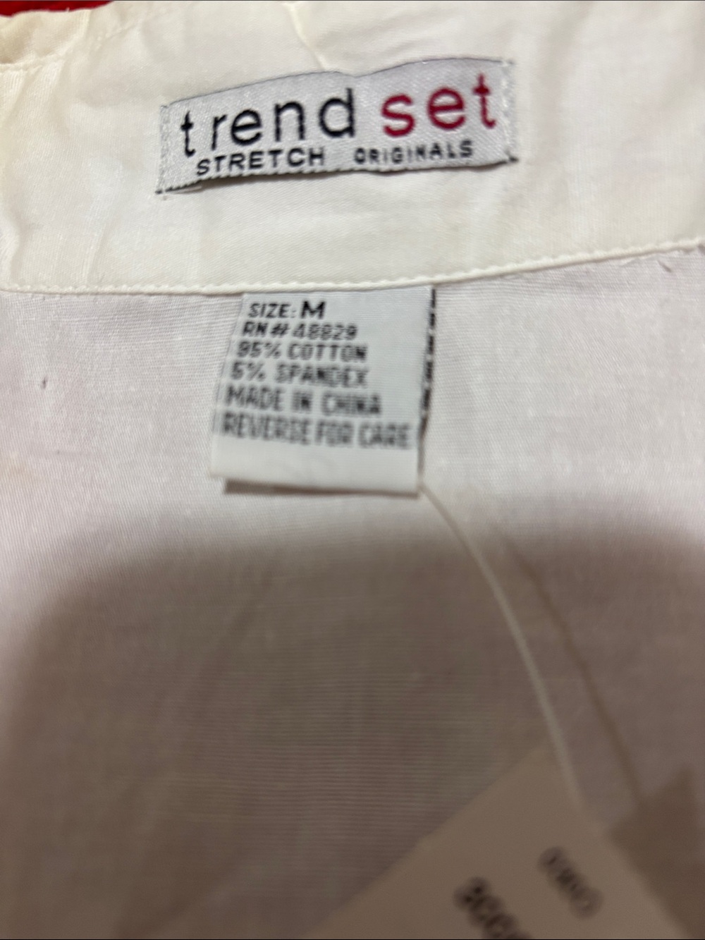 Trend Setter Diva Boutique White wrap around blouse. Wear alone or w/under